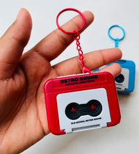 Retro Sound Cassette Keychain held in hand - Blue
